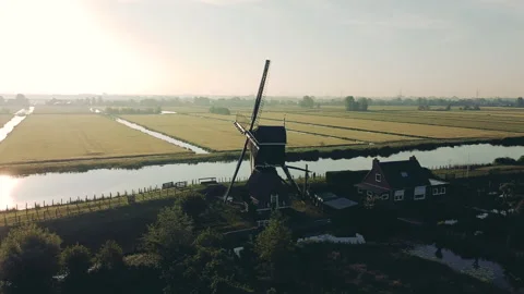 Aerial view of a traditional windmill at sunset in The Netherlands. Stock Footage 183351706