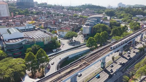 Aerial view of traffic and MRT train near Taman Mutiara station in Cheras Stock Footage 332980935