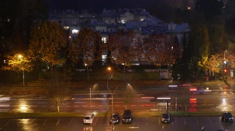 Aerial view of traffic flow and parking lot on raining day at night Video stock 68996989