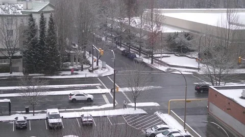 Aerial view of traffic flow and parking lot on cold blizzard snow winter day Video stock 83865907