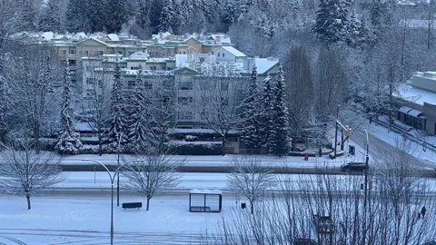 Aerial view of traffic flow on cold blizzard snow winter day Video stock 170760546