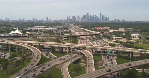 Aerial view of traffic on I-45 South freeway with downtown Houston in background Stock Footage 331687056