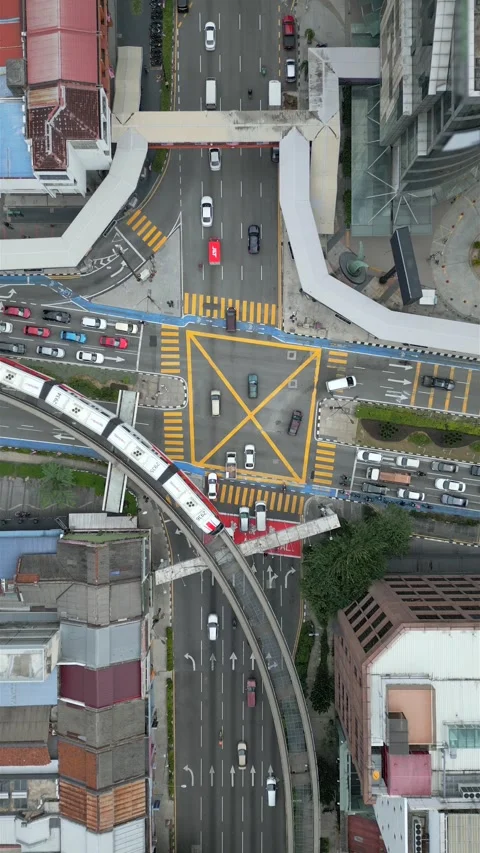 Aerial view of traffic at an intersection in downtown Kuala Lumpur, Malaysia Stock Footage 283319887