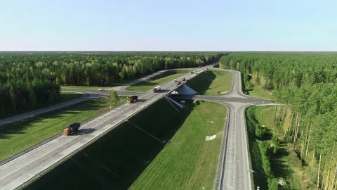 Aerial view of traffic intersection, road interchange. Trucks and cars are Stock-Footage 139894967