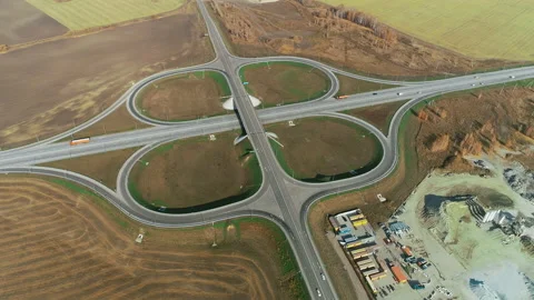 Aerial view of traffic intersection. Trucks and cars drive along the highway Stock-Footage 133631082
