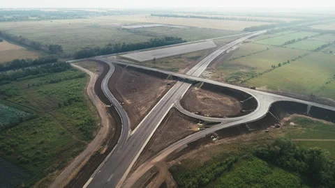 Aerial view of a traffic intersection under construction. Transport interchange Stock Footage 138019491