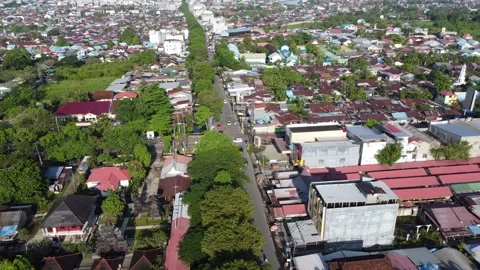 Aerial view of the traffic light intersection on Jalan Veteran Banjarmasin .. Stock Footage 320221386