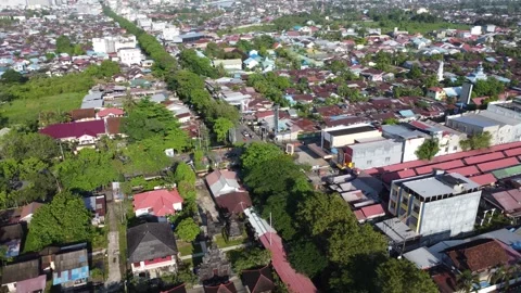 Aerial view of the traffic light intersection on Jalan Veteran Banjarmasin .. Stock Footage 320221421