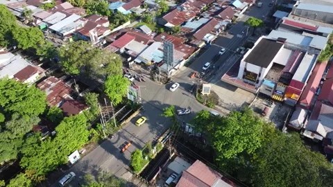 Aerial view of the traffic light intersection on Jalan Veteran Banjarmasin .. Stock Footage 320221609