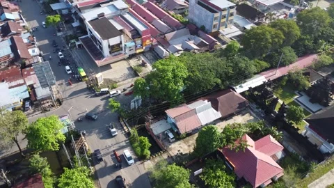 Aerial view of the traffic light intersection on Jalan Veteran Banjarmasin .. Stock Footage 320221618