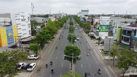 Aerial view of traffic on the main road in Banjarmasin city, South Kalimant.. Stock Footage 317002175