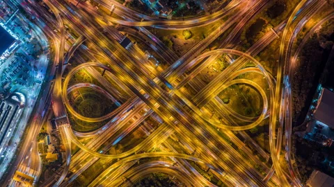 Aerial view of traffic on massive highway intersection at night. Stock Footage 333619607