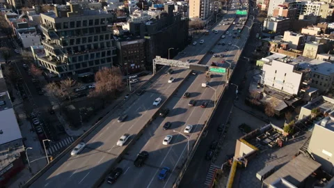 Aerial view of traffic passing through Brooklyn along the BQE Stock Footage 237213674