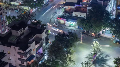Aerial View of Traffic Time lapse at a cross road in an Indian city, India Stock Footage 164915821