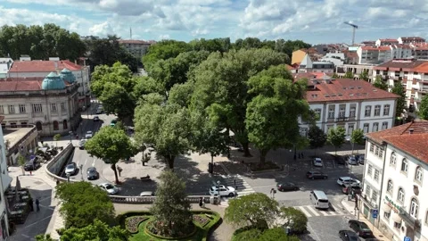 Aerial View of Traffic in a Tree-Lined Town Square in Coimbra Stock-Footage 345840370