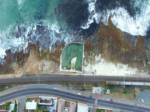 Aerial View of Train and Tidal Pool in Kalk Bay, Cape Town Stock Footage 79759664
