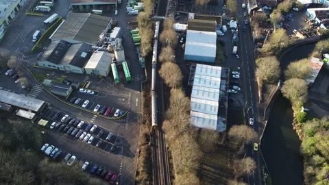 Aerial view of a train arriving at a train station in Birmingham UK Видео 168739213