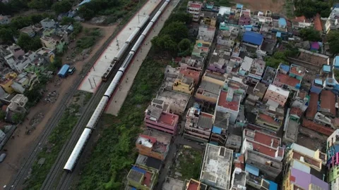 Aerial view of Train Chase in Indian Street Stock Footage 161403253