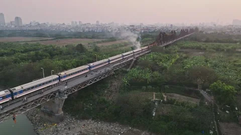 Aerial View of Train Crossing Historic Long Bien Bridge over the Red River in Ha Stock-Footage 344741614