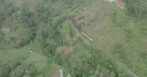 Aerial View of Train Crossing the Nine Arches Bridge in Sri Lanka Stock Footage 319304361
