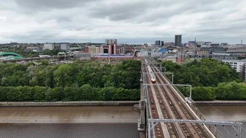 Aerial view Train crossing River Tyne 8th Aug 2024 Newcastle UK Stock Footage 281404347