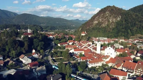 Aerial view of  train heading towards the railway station of Kamnik city center Video stock 220960998