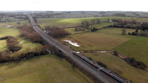 Aerial View Of Train On Kettering To London Railway Line Northamptonshire Stock Footage 103842256