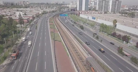 AERIAL VIEW OF TRAIN METRO SUBWAY LEAVING THE STATION AND CAMERA FOLLOWS  4K Stock Footage 101334304