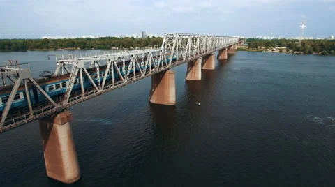 Aerial View of Train Moving on Railway Bridge Stock Footage 68639306