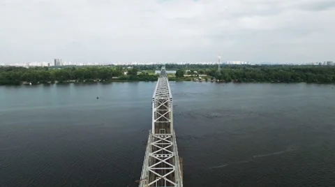 Aerial View of Train Moving on Railway Bridge Stock Footage 68721841