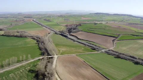 Aerial view of a train moving through the fields in Castilla y León, Spain Stock Footage 151468645