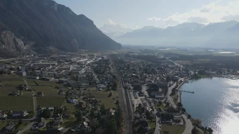 Aerial View of Train Moving Through Alpine Valley near Villeneuve Switzerland 库存影片 330117211