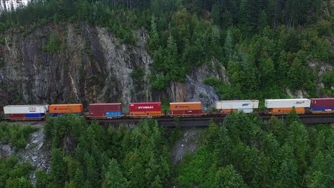 Aerial view of train on narrow mountain pass Stock Footage 75448353