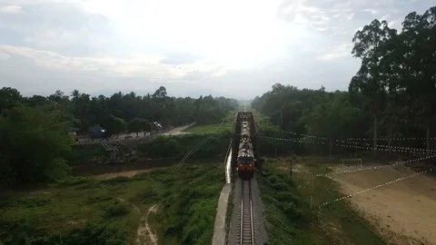 Aerial view. The train is passing through the bridge. Stock Footage 120356418