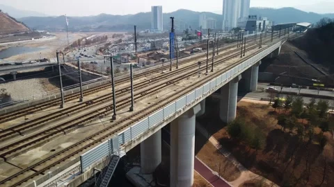 Aerial view of a train passing through Ulsan station in winter, South Korea. Stock-Footage 236141621