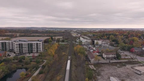 Aerial view of train passing through suburban area Stock Footage 320417117