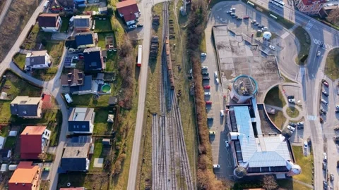 Aerial view train passing through town Stock Footage 330429274