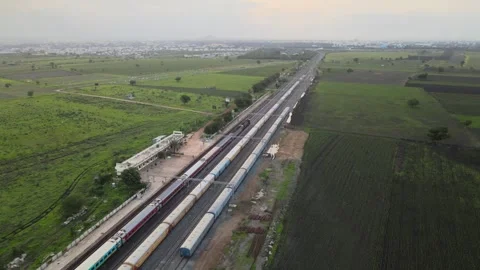 Aerial View of Train Passing Through Agricultural Fields in Tumkur India Video stock 333160950