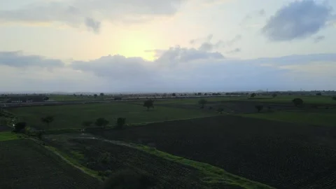 Aerial View of Train Passing Through Agricultural Fields in Tumkur India Stock Footage 333160954