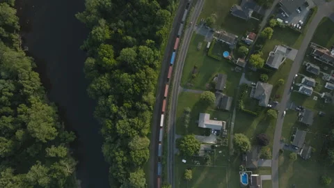 Aerial view of a train passing through Pennsylvania's Lehigh Valley Stock Footage 342547199