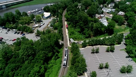 Aerial view of train pulling into a station in Bordentown, New Jersey Video stock 133858107
