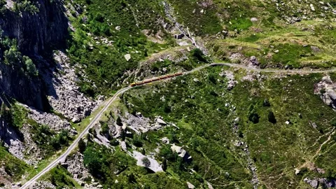 Aerial view of a train in the Pyrenees mountains, France. Stock Footage 340263182