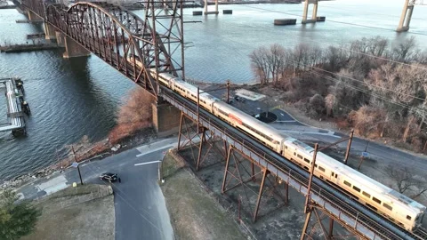Aerial View of a Train on a Railroad Bridge Crossing the Delaware River Stock Footage 230764544