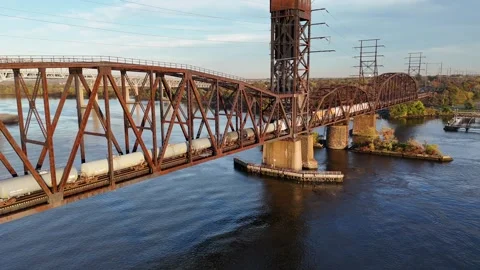 Aerial View of a Train on a Railroad Bridge Crossing the Delaware River Stock Footage 279530596