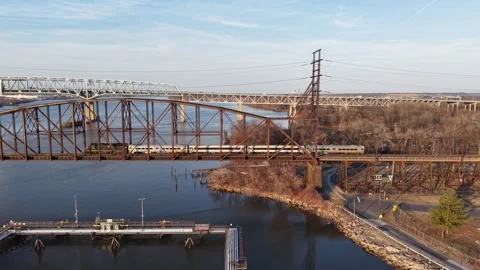 Aerial View of a Train on a Railroad Bridge Crossing the Delaware River Stock Footage 304565903
