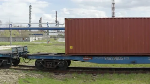 Aerial view of a train on the rails next to the production buildings, chemical Stock Footage 170146151