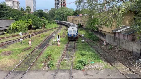 Aerial view of train reaching railway station at Colombo fort, Sri Lanka Stock Footage 203484733