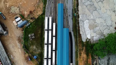 Aerial view. Train station and train where people used to commute into the city. Vídeos de archivo 82804550