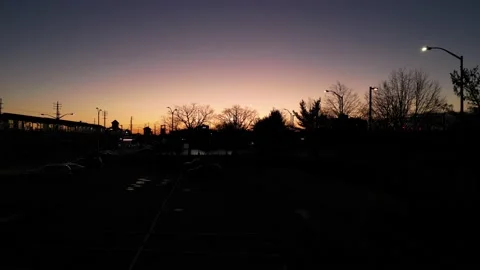 Aerial view of the train station and the car lights at sunset Vidéo 227710783