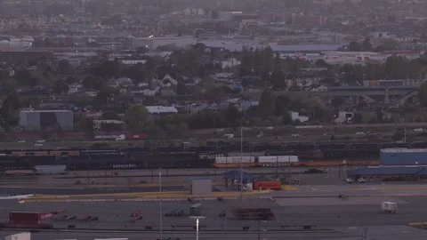 Aerial View of a Train Station and Industrial Area in Oakland at Sunrise Stock Footage 334123559